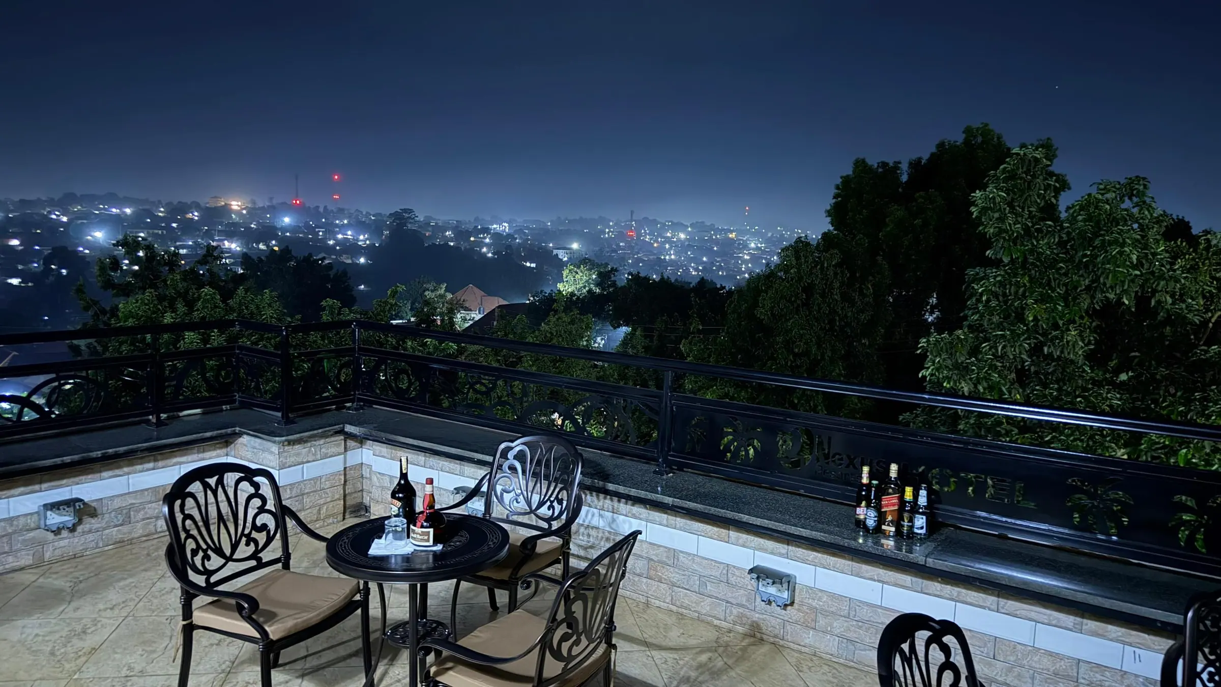 Tables on the rooftop terrace looking out over the city